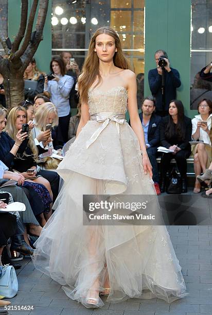 Model walks the runway at Monique Lhuillier Bridal Spring/Summer 2017 Runway Show at Laduree Soho on April 15, 2016 in New York City.