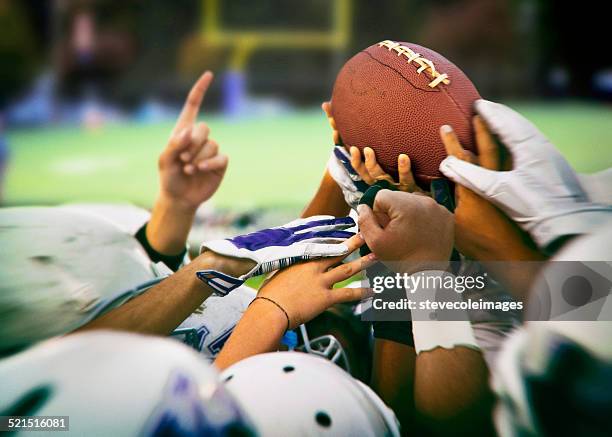 american football - football huddle stock pictures, royalty-free photos & images