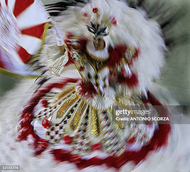 The Queen of the Brazilian samba school Portop da Pedra spins as she performs 07 February on the second evening of the carnival competition along...