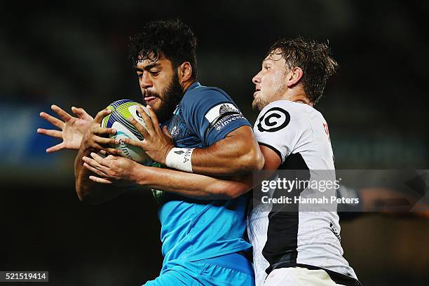 Etienne Oosthuizen of the Sharks tackles Akira Ioane of the Blues during the round eight Super Rugby match between the Blues and the Sharks at Eden...