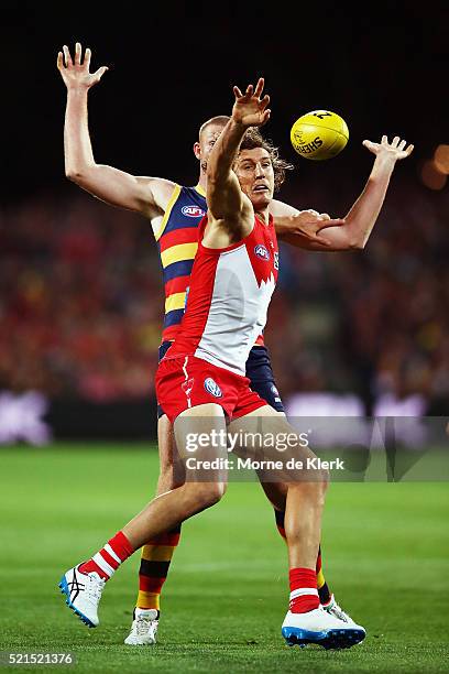 Kurt Tippett of the Swans competes for the ball with Sam Jacobs of the Crows during the round four AFL match between the Adelaide Crows and the...