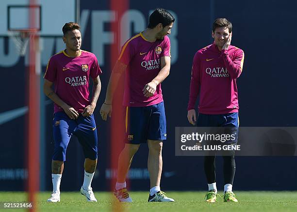 Barcelona's Argentinian forward Lionel Messi , Barcelona's Brazilian forward Neymar and Barcelona's Uruguayan forward Luis Suarez take part in a...