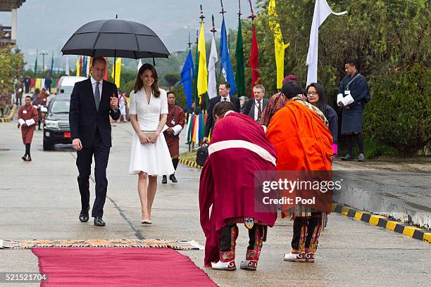 Prince William, Duke of Cambridge and Catherine, Duchess of Cambridge bid farewell at Paro Airport before boarding their flight to Agra for their...