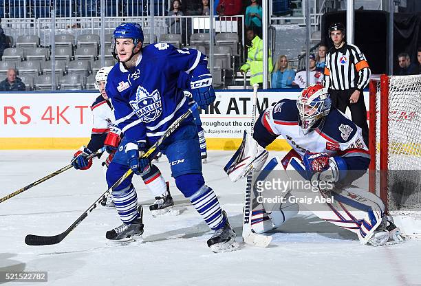 Zach Hyman of the Toronto Marlies puts a screen on Magnus Hellberg of the Hartford Wolf Pack during game action on April 13, 2016 at the Ricoh...