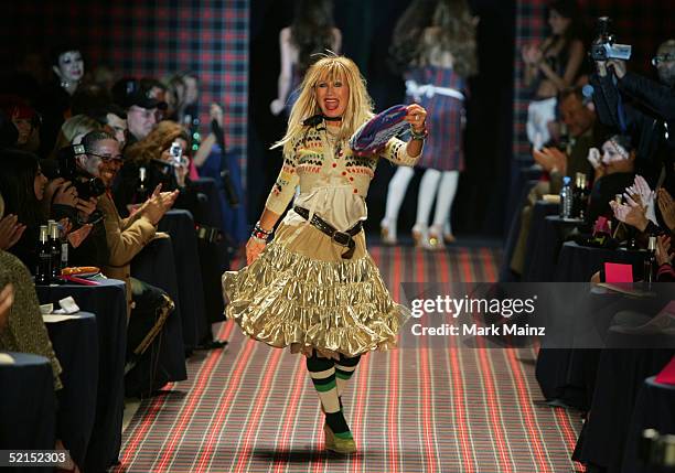 Designer Betsey Johnson walks on the runway at the Betsey Johnson Fall 2005 show during Olympus Fashion Week at Bryant Park February 7, 2005 in New...