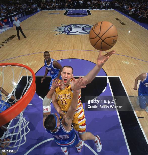 Zydrunas Ilgauskas of the Cleveland Cavaliers shoots over Brad Miller of the Sacramento Kings during a game at Arco Arena on January 20, 2005 in...
