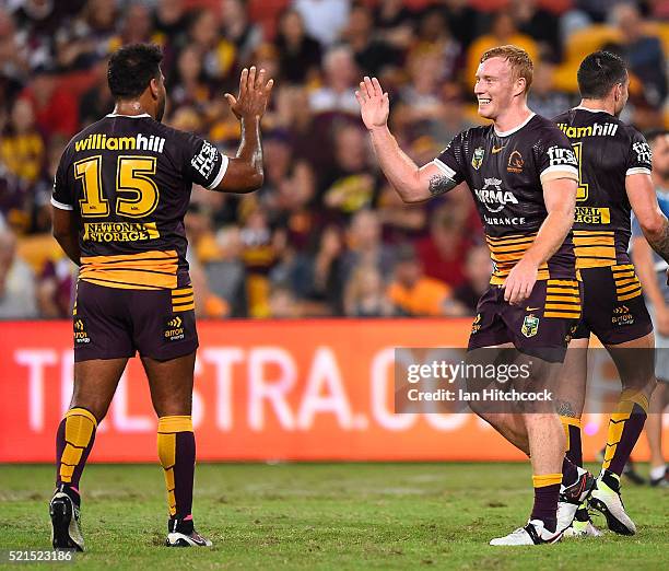 Jack Reed and Sam Thaiday of the Broncos celebrater the try of Anthony Milford of the Broncos during the round seven NRL match between the Brisbane...