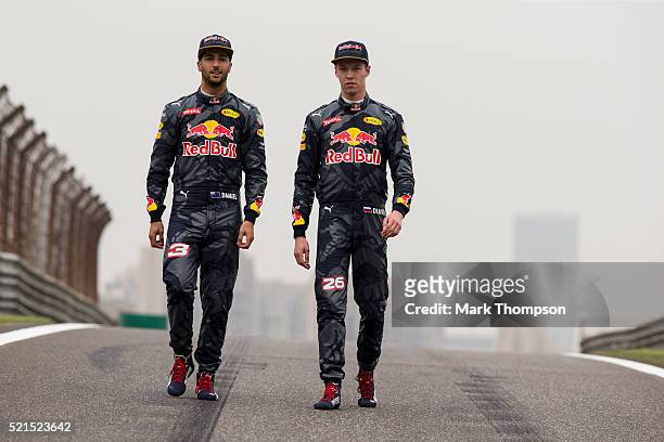Daniel Ricciardo of Australia and Red Bull Racing and Daniil Kvyat of Russia and Red Bull Racing pose for a photo on the track during previews to the...