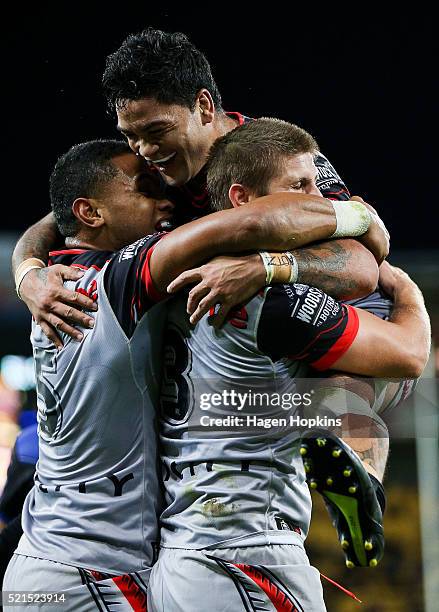 Blake Ayshford of the Warriors celebrates his try with teammates David Fusitu'a and Issac Luke of the Warriors during the round seven NRL match...