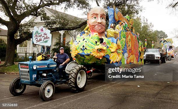 Man pulls a float on a tractor during the historic Proteus parade, founded in 1882, during Mardi Gras festivites February 7, 2005 in New Orleans,...