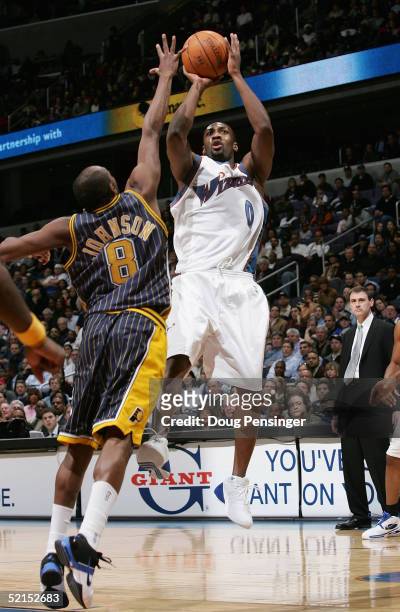 Gilbert Arenas of the Washington Wizards takes a shot over Anthony Johnson of the Indiana Pacers during NBA action on February 7, 2005 at the MCI...