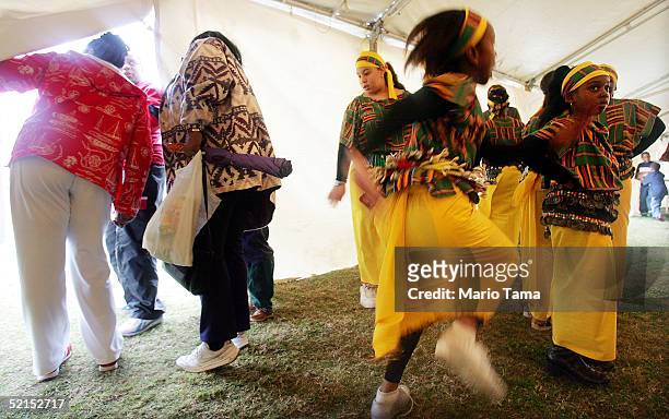 Child performers from the B.W. Cooper Dance and Drum Troupe, an African inspired group, prepare to perform during Mardi Gras festivites February 7,...
