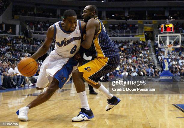 Gilbert Arenas of the Washington Wizards drives against Anthony Johnson of the Indiana Pacers during NBA action on February 7, 2005 at the MCI Center...