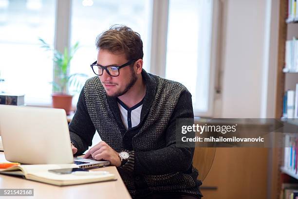 man using laptop - male professor with students stock pictures, royalty-free photos & images