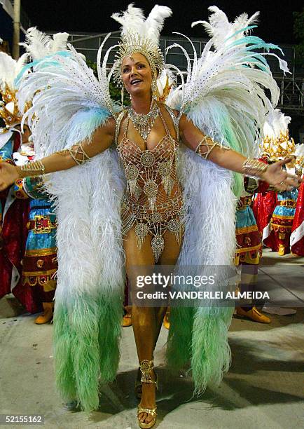 Luiza Brunet, Queen of the Drums of Imperatriz Leoplodinense samba school, performs ahead of the percussion band at the Sambodrome, 08 February 2005,...