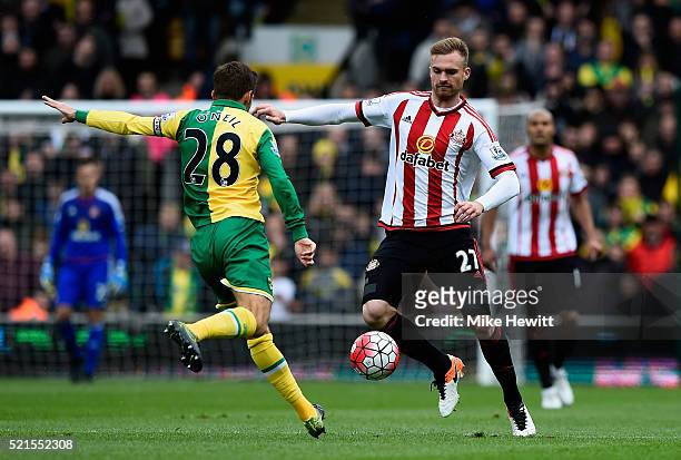 Jan Kirchhoff of Sunderland is closed down by Gary O'Neil of Norwich City during the Barclays Premier League match between Norwich City and...