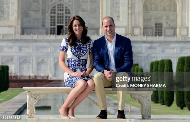 Britain's Prince William, Duke of Cambridgeand Catherine, Duchess of Cambridge pose during their visit to The Taj Mahal in Agra on April 16, 2016....