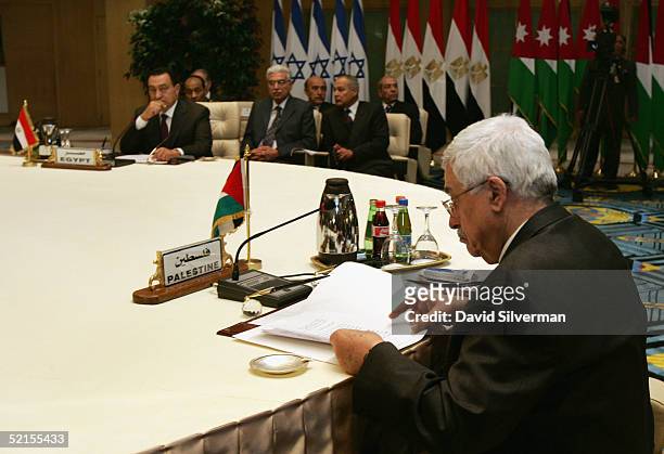 Palestinian Prime Minister, Mahmoud Abbas reads from his speech with his host, Egyptian President Hosni Mubarak looking on, at the start of the peace...