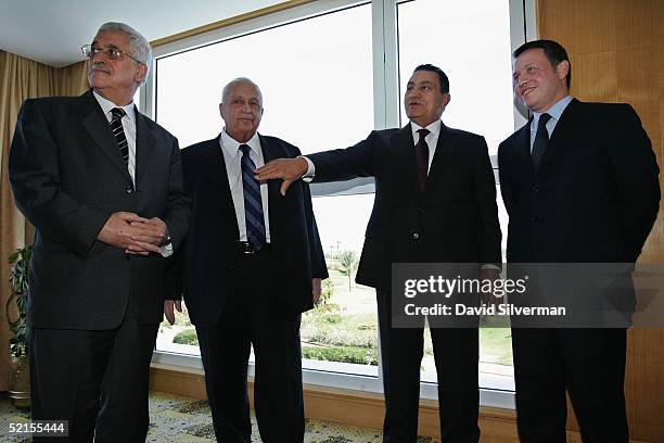 Egyptian President Hosni Mubarak gestures during the photo-op with Palestinian Prime Minister, Mahmoud Abbas, , Israeli Prime Minister Ariel Sharon...