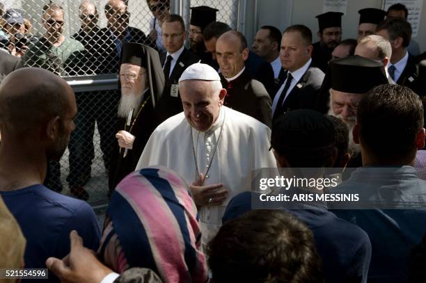 Pope Francis arrives at the Moria detention center in Mytilene on April 16, 2016. Pope Francis received an emotional welcome today on the Greek...