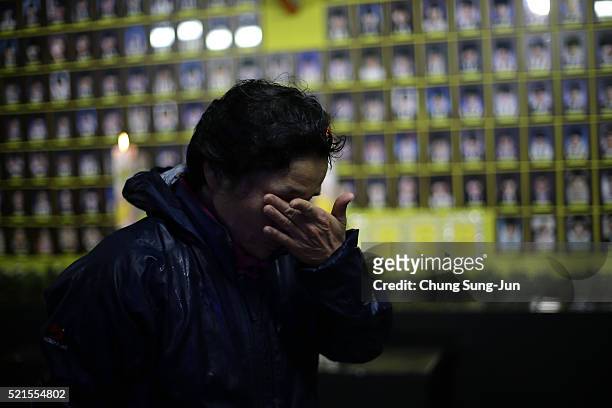 South Korean woman pays tribute at a group memorial altar for victims of the sunken ferry Sewol during the second anniversary of the Sewol disaster...
