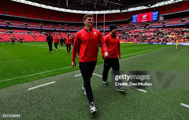 Owen Farrell of Saracens and Neil de Kock of Saracens make their way off the field prior to the Aviva Premiership match between Saracens and...