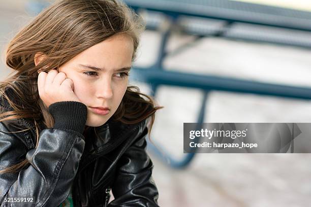 unhappy girl at a picnic table. - masculinidade imagens e fotografias de stock