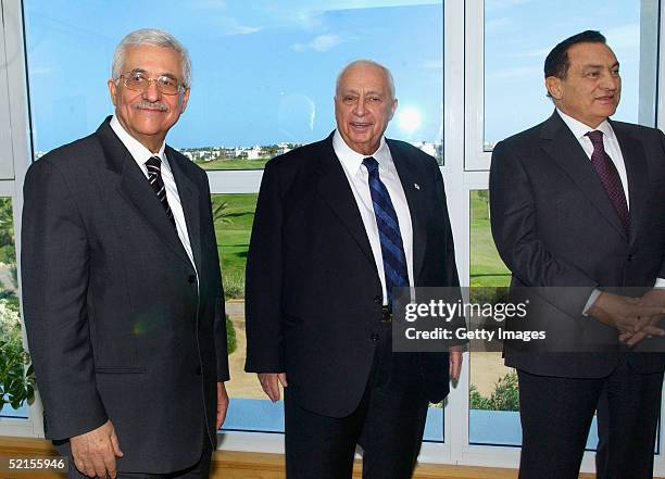 Israeli Prime Minister Ariel Sharon , poses with Palestinian President Mahmoud Abbas and Egyptian President Hosni Mubarak pose for photographs at the...