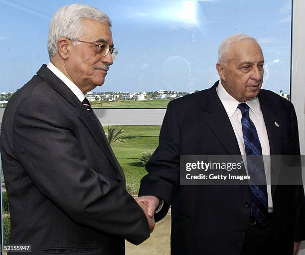 Israeli Prime Minister Ariel Sharon shakes hands with Palestinian President Mahmoud Abbas at the start of the peace summit February 8, 2005 at the...