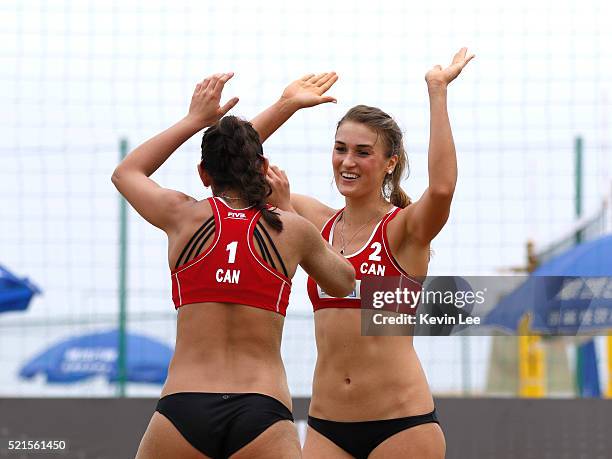 Melissa Humana-Paredes and Taylor Pischke of Canada celebrate at a point at the FIVB Beach Volleyball World Tour 2016 on April 16, 2016 in Xiamen,...