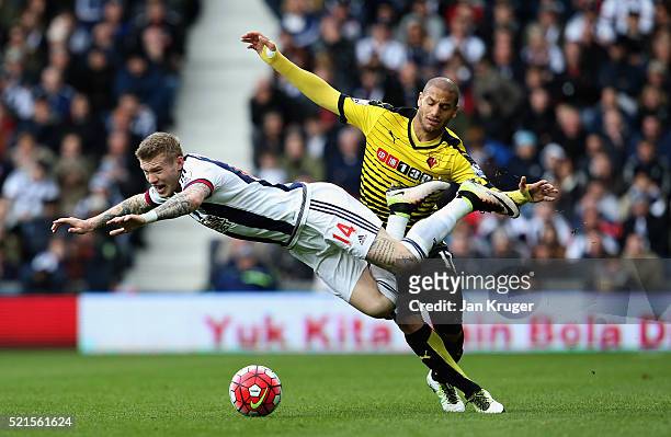 James McClean of West Bromwich Albion is challenged by Adlene Guedioura of Watford during the Barclays Premier League match between West Bromwich...