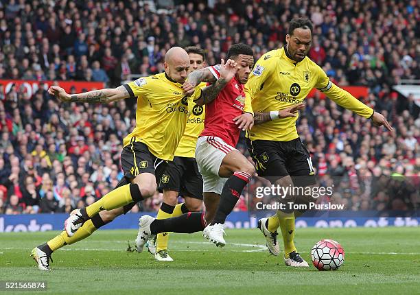 Memphis Depay of Manchester United in action with Alan Hutton and Joleon Lescott of Aston Villa during the Barclays Premier League match between...