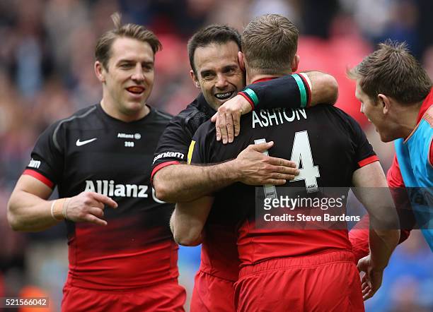 Chris Ashton of Saracens celebrates his 2nd try with Neil De Kock during the Aviva Premiership between Saracens and Harlequins at Wembley Stadium on...
