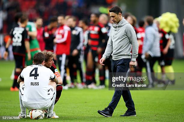 Head coach Niko Kovac of Frankfurt looks dejected next to Marco Russ of Frankfurt after loosing the Bundesliga match between Bayer Leverkusen and...