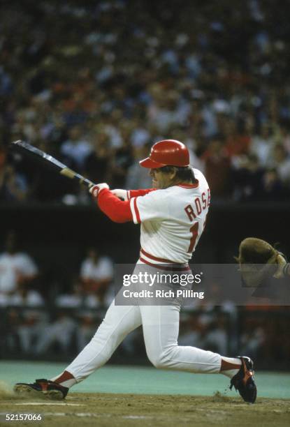 Pete Rose of the Cincinnati Reds swings at a pitch against the San Diego Padres during a game on September 11, 1985 at Riverfront Stadium in...