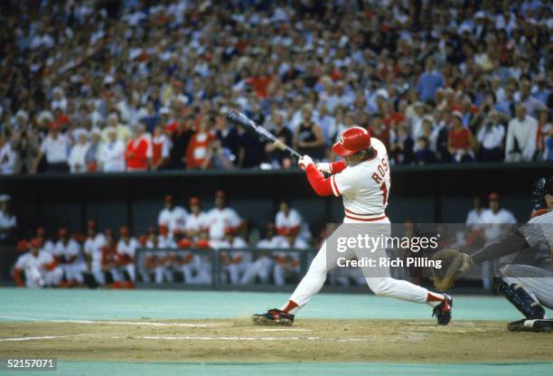 Pete Rose of the Cincinnati Reds swings at a pitch against the San Diego Padres during a game on September 11, 1985 at Riverfront Stadium in...
