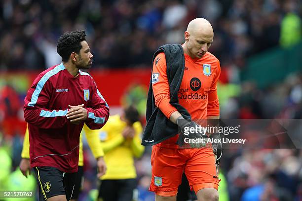 Aston Villa players walk off following their relegation to the Skybet Championship during the Barclays Premier League match between Manchester United...