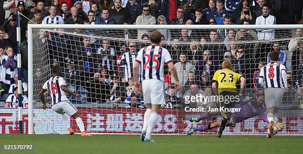 Heurelho Gomes of Watford saves a second penalty by Saido Berahino of West Bromwich Albion during the Barclays Premier League match between West...