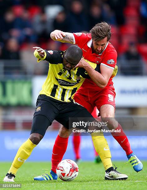 Matt McClure of Dagenham & Redbridge tackles with Ollie Palmer of Leyton Orient during the Sky Bet League Two match between Leyton Orient and...