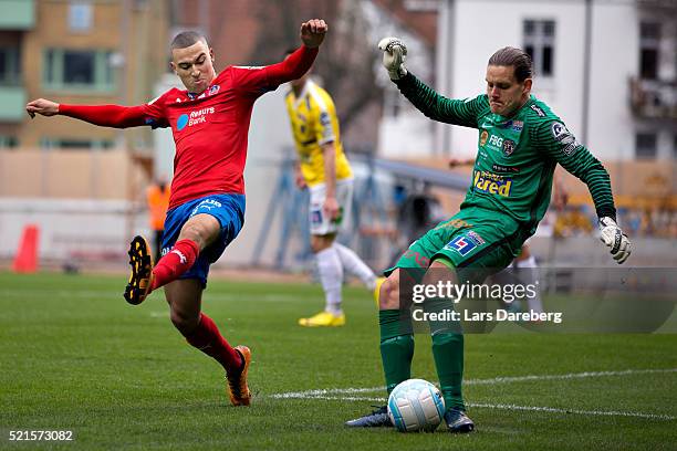 Jordan Larsson of Helsingborgs IF and Otto Martier, goaltender of Falkenberg during the Allsvenskan match between Helsingborgs IF v Falkenbergs FF at...