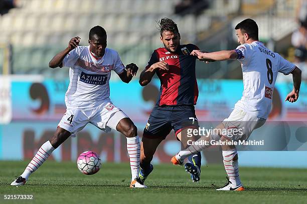 Isaac Cofie and Raffaele Bianco of Carpi FC battles for the ball with Panagiotis Tachtsidis of Genoa CFC during the Serie A match between Carpi FC...