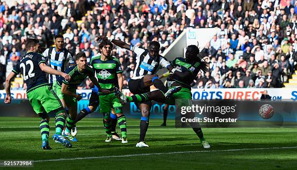 Newcastle player Moussa Sissoko shoots to score the second Newcastle goal during the Barclays Premier League match between Newcastle United and...