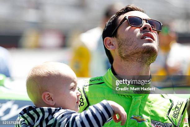 Kyle Larson, driver of the BELKIN Chevrolet, takes part in pre-race ceremonies with girlfriend Katelyn Sweet and son Owen prior to the NASCAR XFINITY...