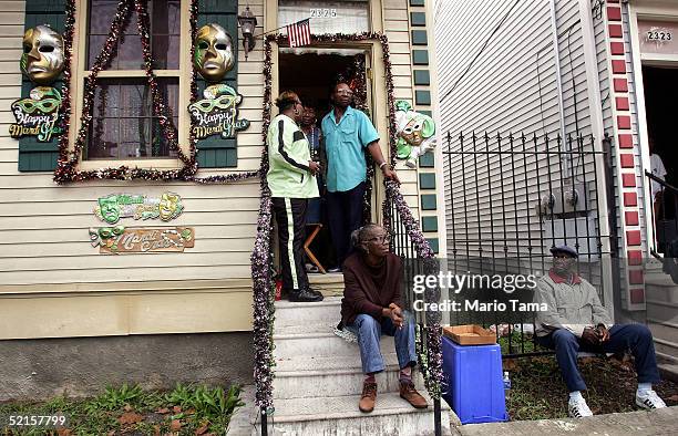 People watch the Zulu parade, a primarily African-American parade, during Mardi Gras festivities February 8, 2005 in New Orleans, Louisiana. Mardi...