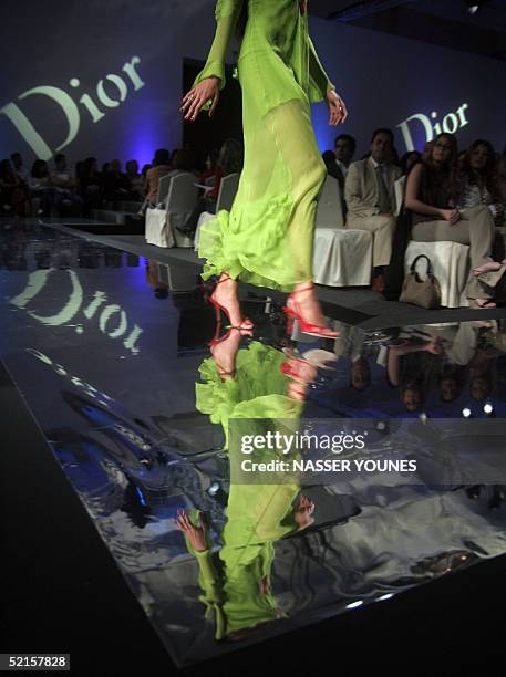 Model presents a creation from Christian Dior's Spring-Summer 2005 collection during Dubai's fashion week, sponsored by Burjuman Mall, at a five-star...