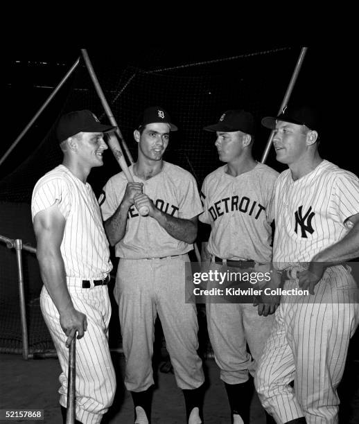 Roger Maris and Mickey Mantle , of the New York Yankees, flank Rocky Colavito and Norm Cash of the Detroit Tigers, as they pose together around the...