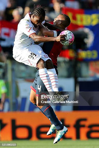 Sebastien De Maio of Carpi FC battles for the ball with Jerry Mbakogu of Genoa CFC during the Serie A match between Carpi FC and Genoa CFC at Alberto...