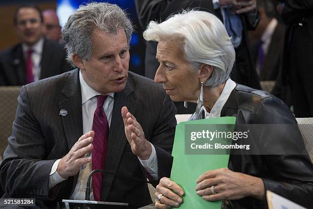 David Lipton, first deputy managing director of the IMF, left, speaks with Christine Lagarde, managing director of the International Monetary Fund ,...