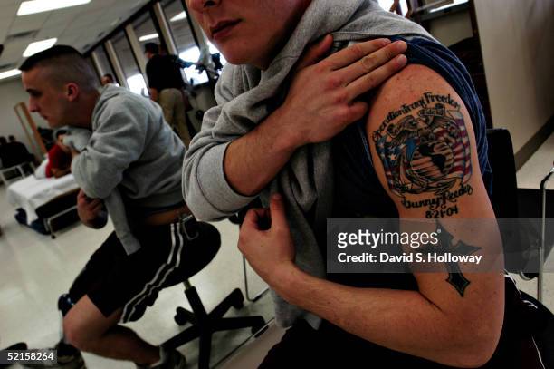 Corey Webb shows the tattoo he got in memory of his friend Gunnery Sgt. Edward Reeder who was killed in Fallujah during the same attack in which Webb...