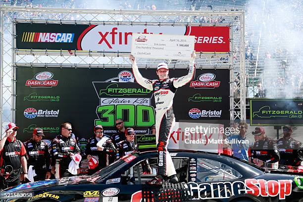 Erik Jones, driver of the Gamestop/Performance Designed Products Toyota, celebrates in Victory Lane after winning the NASCAR XFINITY Series...